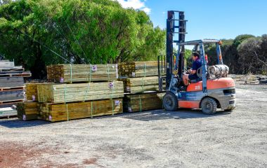 Photo of Gary using the forklift at the timber yard to load Building Supplies for deleivery to Busselton & Dunsborough.