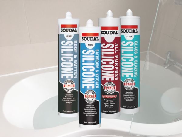 A selection of Soudal Trade Quality Silicone products, including Roof & Gutter, Bathroom & Kitchen, All Purpose, and Glass & Glazing silicones, placed in front of a bathroom setting to emphasise their versatility and professional-grade quality