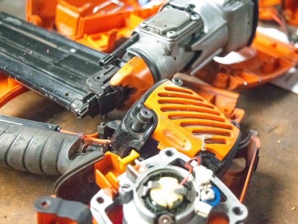 A power tool pulled apart for assessment during repairs