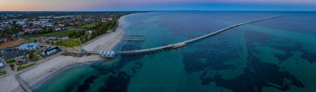 Aerial view of Busselton Jetty and coastline showing the region impacted by past storms
