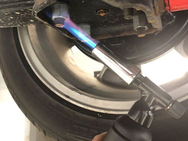 HDUT Ultimate Blow Torch heating a trailer component as part of a repair.