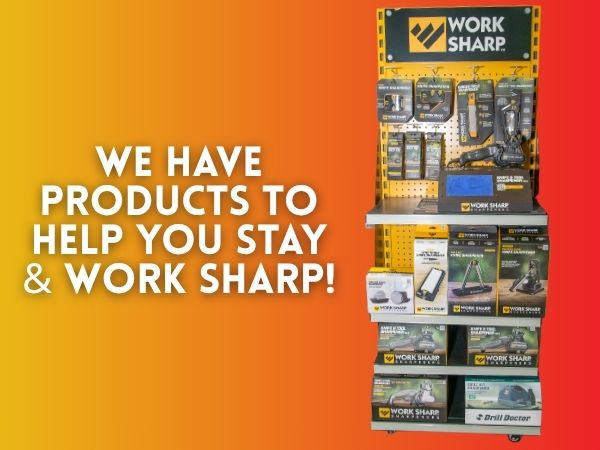 Retail display stand promoting Work Sharp™ sharpeners with text: We Have Products to Help You Stay & Work Sharp